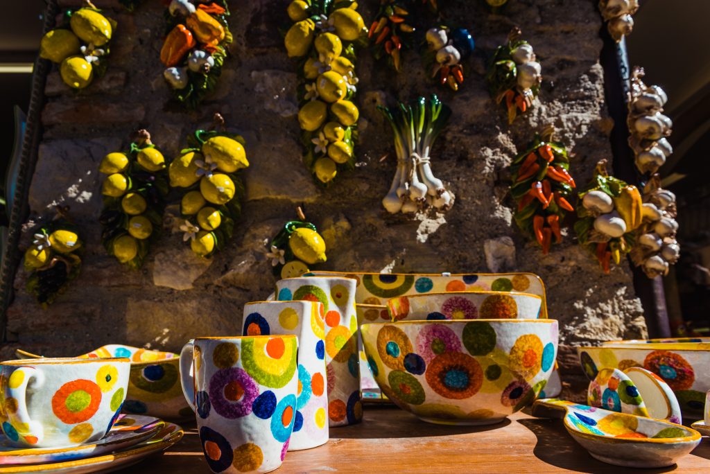 Sirmione, Italy - September 28, 2021: Ceramic souvenirs shaped like lemons and garlic.